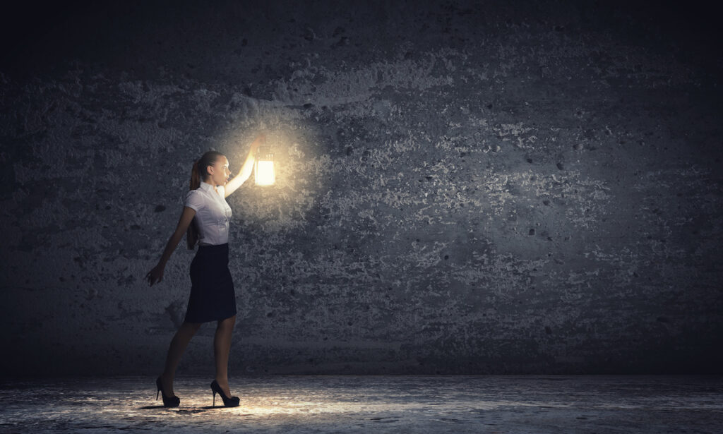 Business woman with lantern